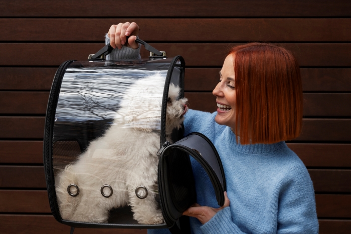 woman-carrying-her-pet-dog-special-carrier-bag
